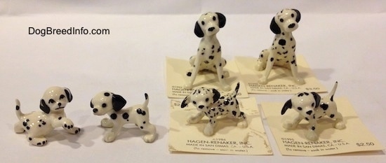 There are six hand painted Dalmatian figurines. Four are puppies and two are full grown Dalmatians.